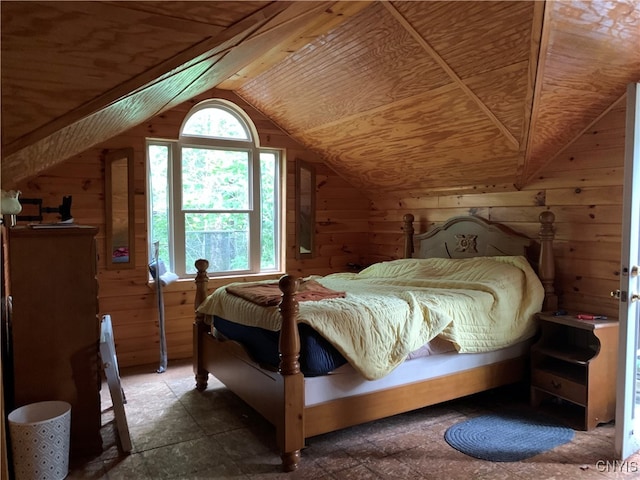 bedroom featuring lofted ceiling, wood walls, and wooden ceiling