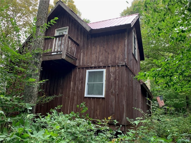 view of home's exterior featuring metal roof