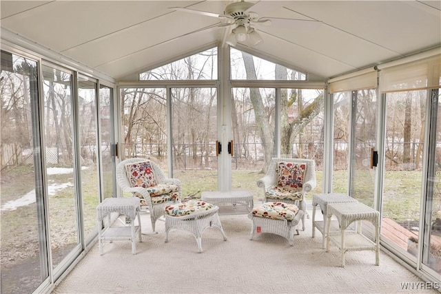 unfurnished sunroom featuring lofted ceiling and ceiling fan