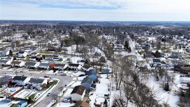 snowy aerial view featuring a residential view