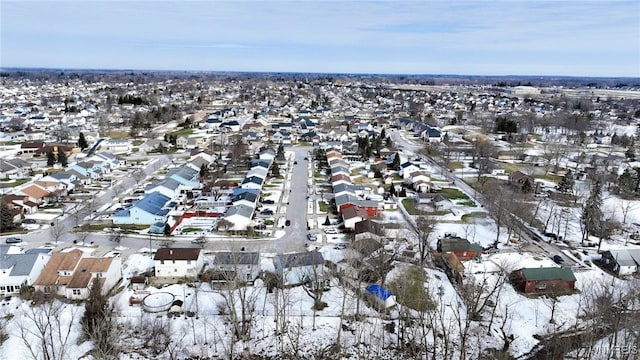 snowy aerial view featuring a residential view