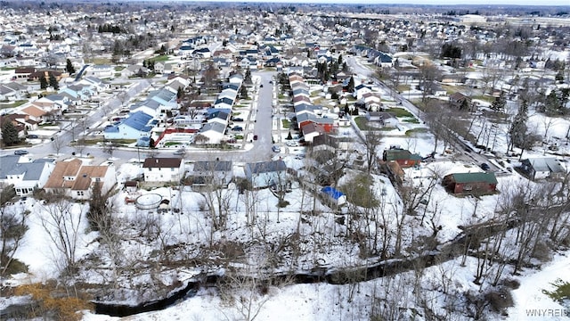 snowy aerial view featuring a residential view