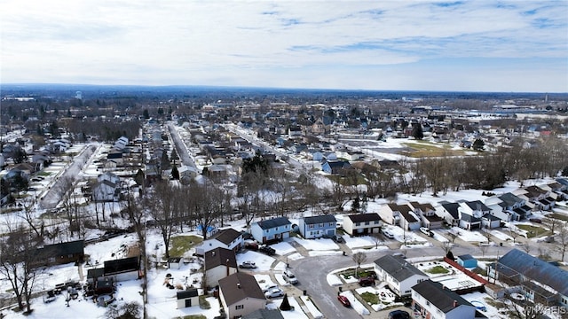 snowy aerial view featuring a residential view