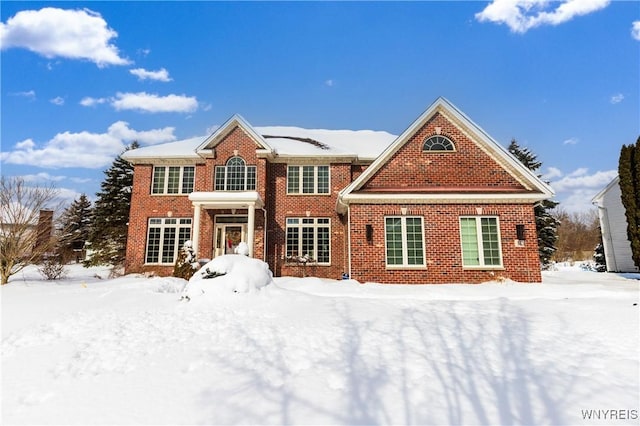 view of front of house featuring brick siding