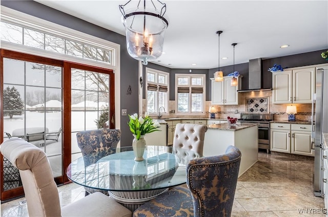 dining room featuring a notable chandelier and recessed lighting