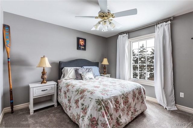 bedroom featuring ceiling fan, dark carpet, and baseboards