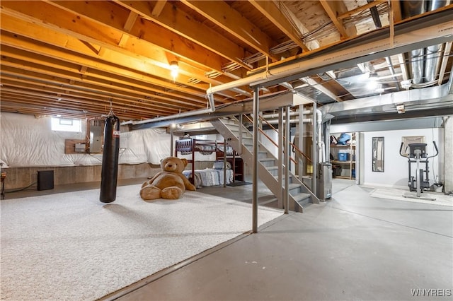 basement with stairs and electric panel