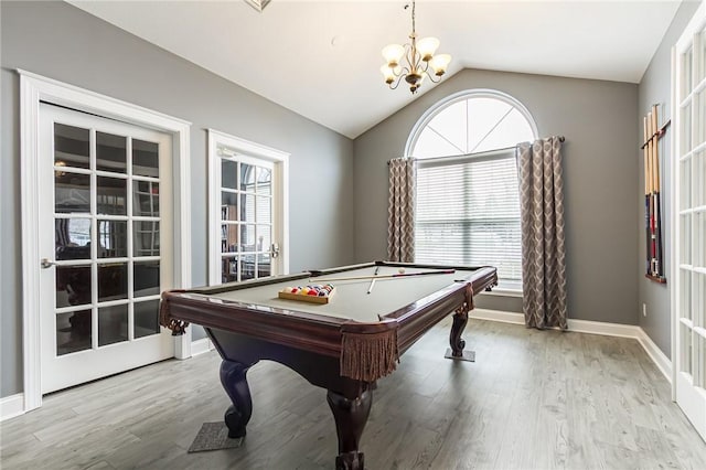 game room with baseboards, vaulted ceiling, wood finished floors, and french doors