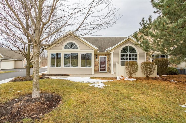 ranch-style house with a front lawn