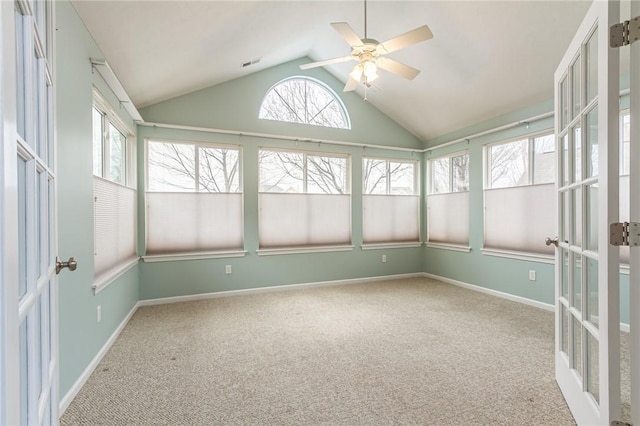 unfurnished sunroom with visible vents, vaulted ceiling, and a ceiling fan