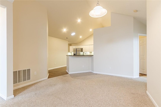 unfurnished living room with carpet, visible vents, baseboards, and recessed lighting