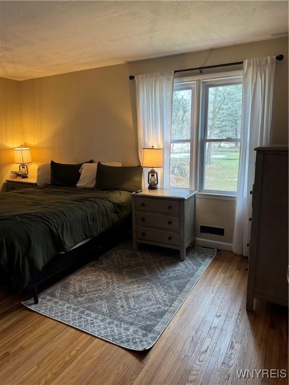 bedroom with wood finished floors