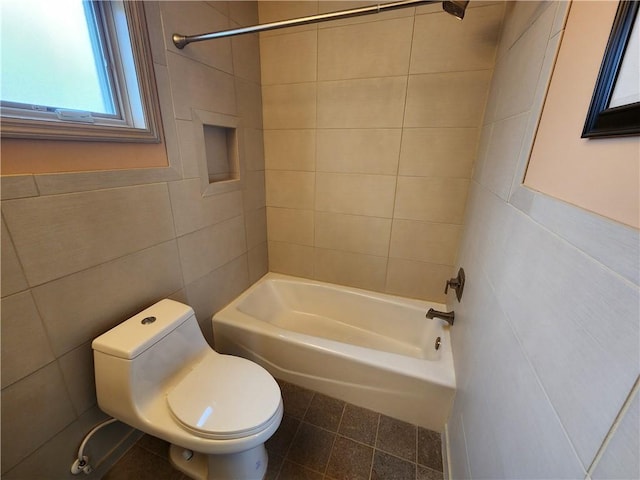 full bath featuring bathtub / shower combination, tile walls, toilet, and tile patterned floors