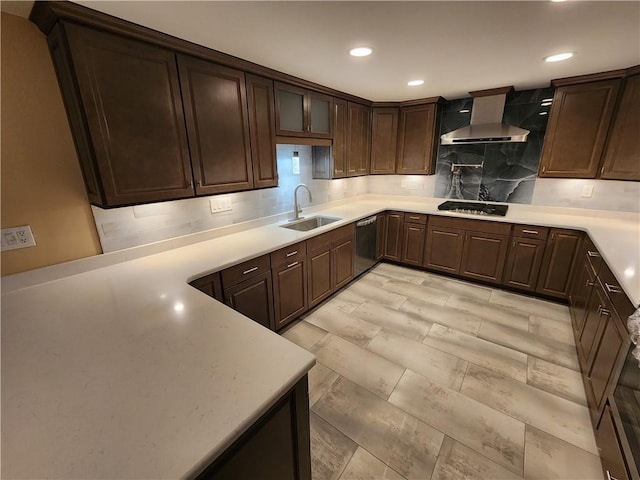 kitchen with decorative backsplash, a sink, gas cooktop, dishwasher, and wall chimney exhaust hood