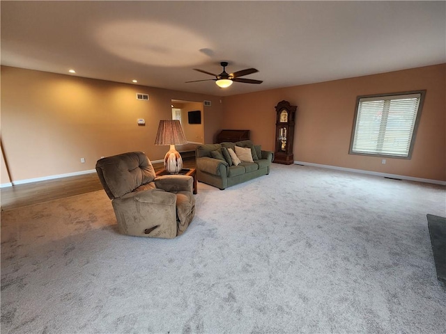 living room with ceiling fan, carpet floors, recessed lighting, and baseboards