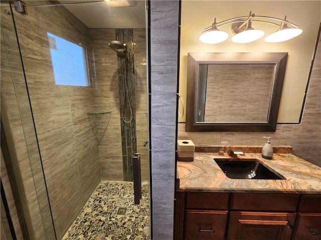 full bathroom featuring a stall shower and vanity