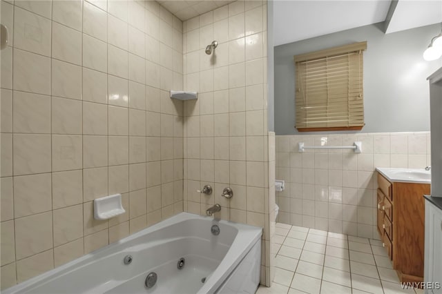 bathroom featuring tile walls, a combined bath / shower with jetted tub, toilet, vanity, and tile patterned floors