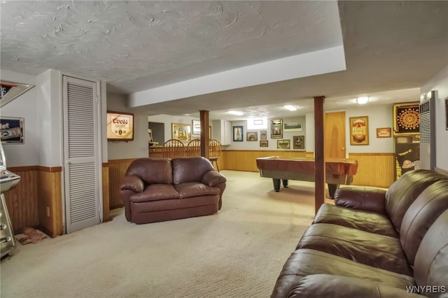 living room featuring carpet floors, wood walls, billiards, and wainscoting