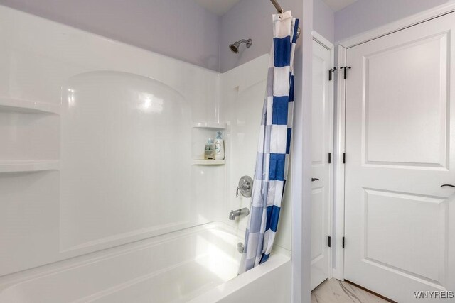 12 Kevwood Ln, Lancaster, NY 14086 - bathroom with shower / bath combo with shower curtain and marble finish floor