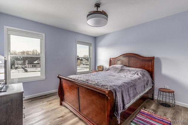 12 Kevwood Ln, Lancaster, NY 14086 - bedroom featuring baseboards and light wood finished floors