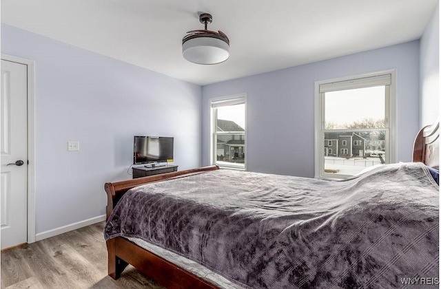 12 Kevwood Ln, Lancaster, NY 14086 - bedroom with baseboards and wood finished floors