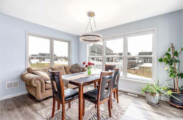 12 Kevwood Ln, Lancaster, NY 14086 - dining space with baseboards, a wealth of natural light, wood finished floors, and visible vents