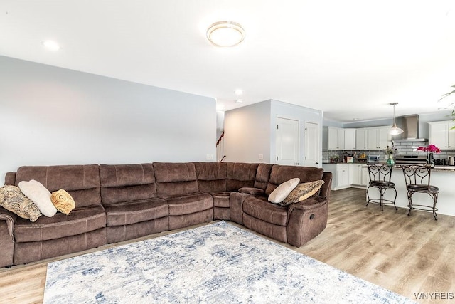 12 Kevwood Ln, Lancaster, NY 14086 - living area with stairway, recessed lighting, and light wood finished floors
