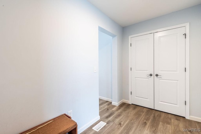 12 Kevwood Ln, Lancaster, NY 14086 - hallway with visible vents, light wood-style flooring, and baseboards