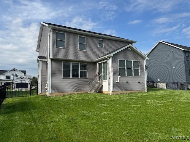 12 Kevwood Ln, Lancaster, NY 14086 - back of property with entry steps, a yard, and a fenced backyard