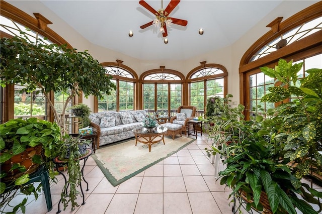 sunroom with vaulted ceiling and a ceiling fan