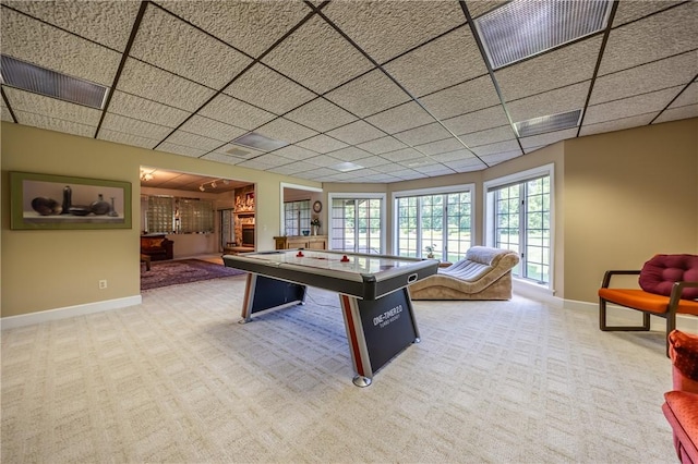 playroom with a drop ceiling, carpet, visible vents, and baseboards