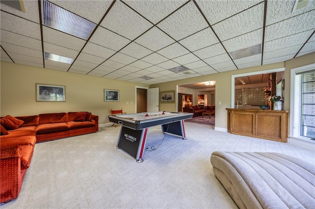 playroom with baseboards, carpet flooring, and a drop ceiling