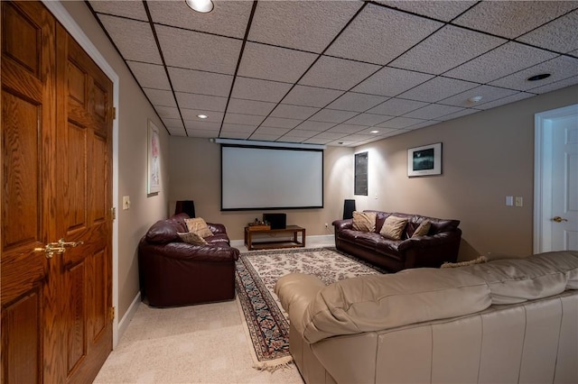 cinema room with light carpet, recessed lighting, a drop ceiling, and baseboards