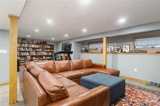 living room featuring recessed lighting, light wood-style flooring, and baseboards