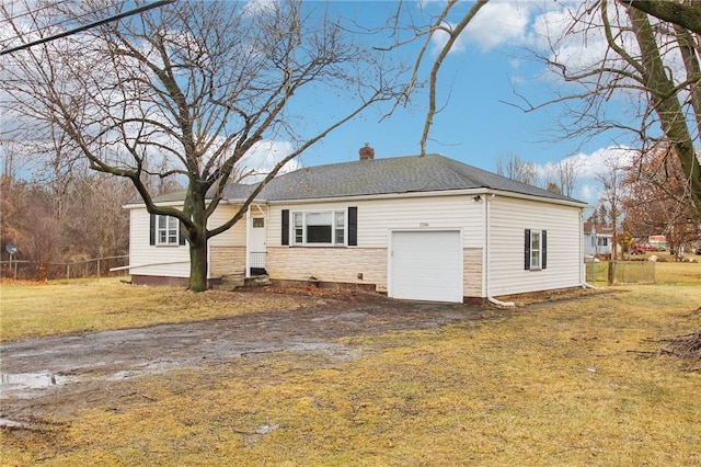 single story home featuring a garage, dirt driveway, a chimney, fence, and a front lawn