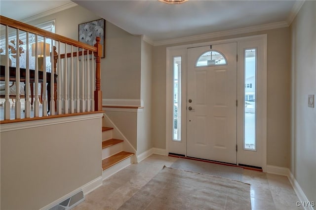 entryway with baseboards, stairs, and ornamental molding