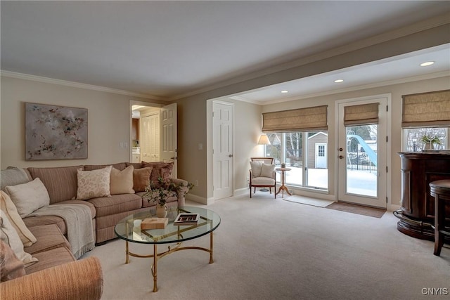 living area featuring recessed lighting, light carpet, crown molding, and baseboards