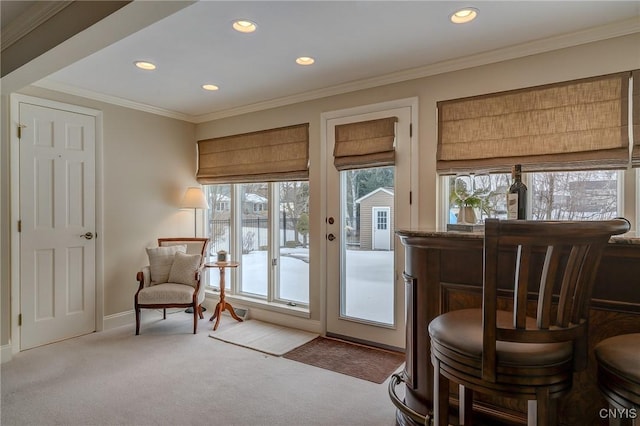 entryway with carpet, crown molding, baseboards, and recessed lighting