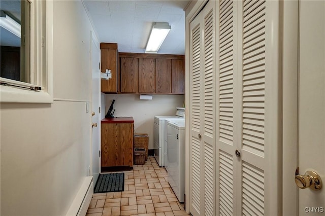 clothes washing area featuring brick floor, cabinet space, independent washer and dryer, and baseboard heating