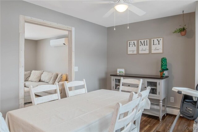 dining room featuring dark wood-style floors, a baseboard radiator, a wall unit AC, and a ceiling fan