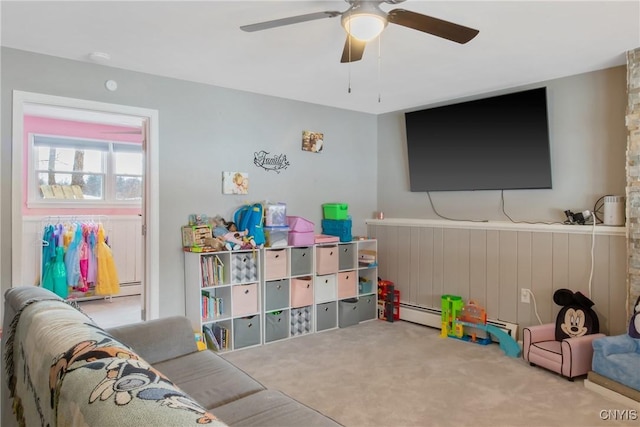 rec room with carpet flooring and ceiling fan