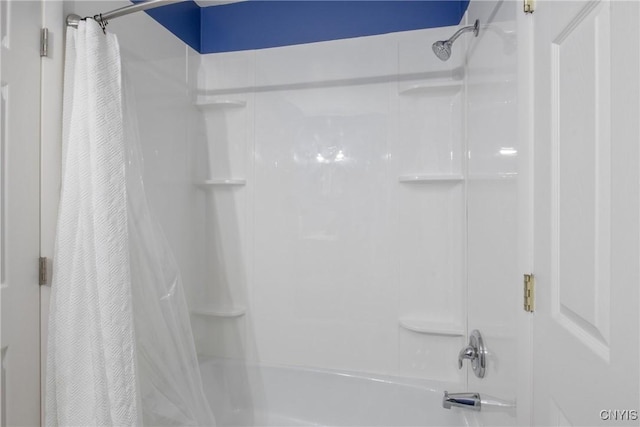 full bathroom featuring shower / bath combo with shower curtain