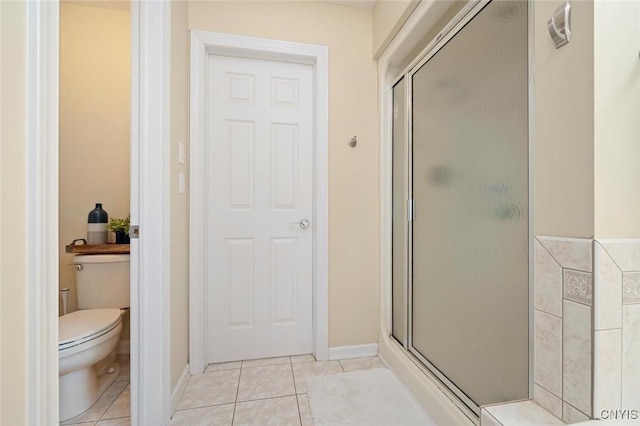 full bath featuring a shower stall and tile patterned floors