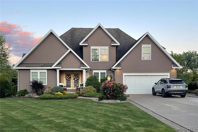 view of front of house with an attached garage, concrete driveway, french doors, roof with shingles, and a front lawn