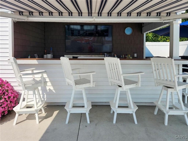 view of patio with outdoor dry bar