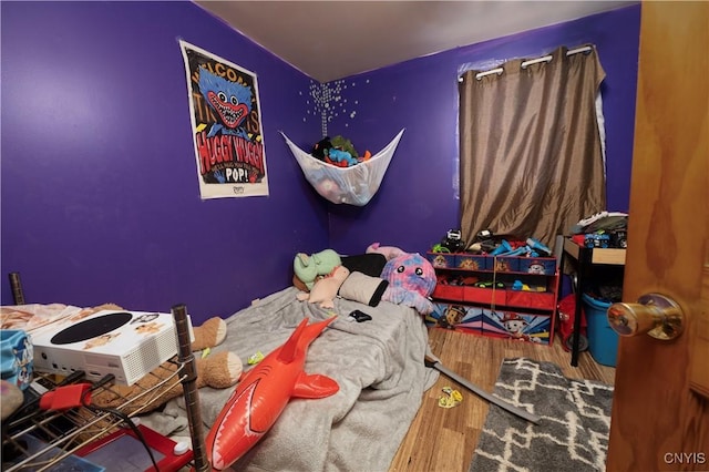 bedroom with wood finished floors