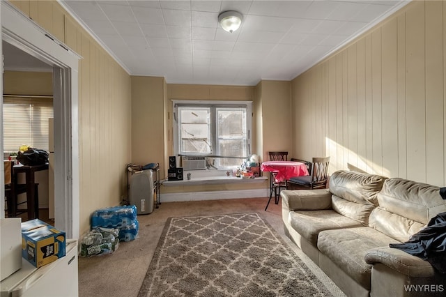 carpeted living area featuring cooling unit and crown molding