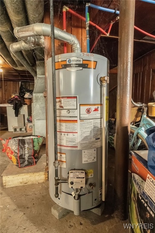 utility room with gas water heater