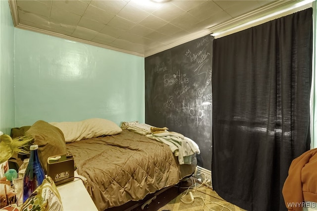 bedroom featuring crown molding