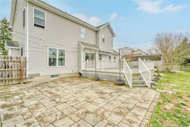 back of property with a patio, fence, and a wooden deck